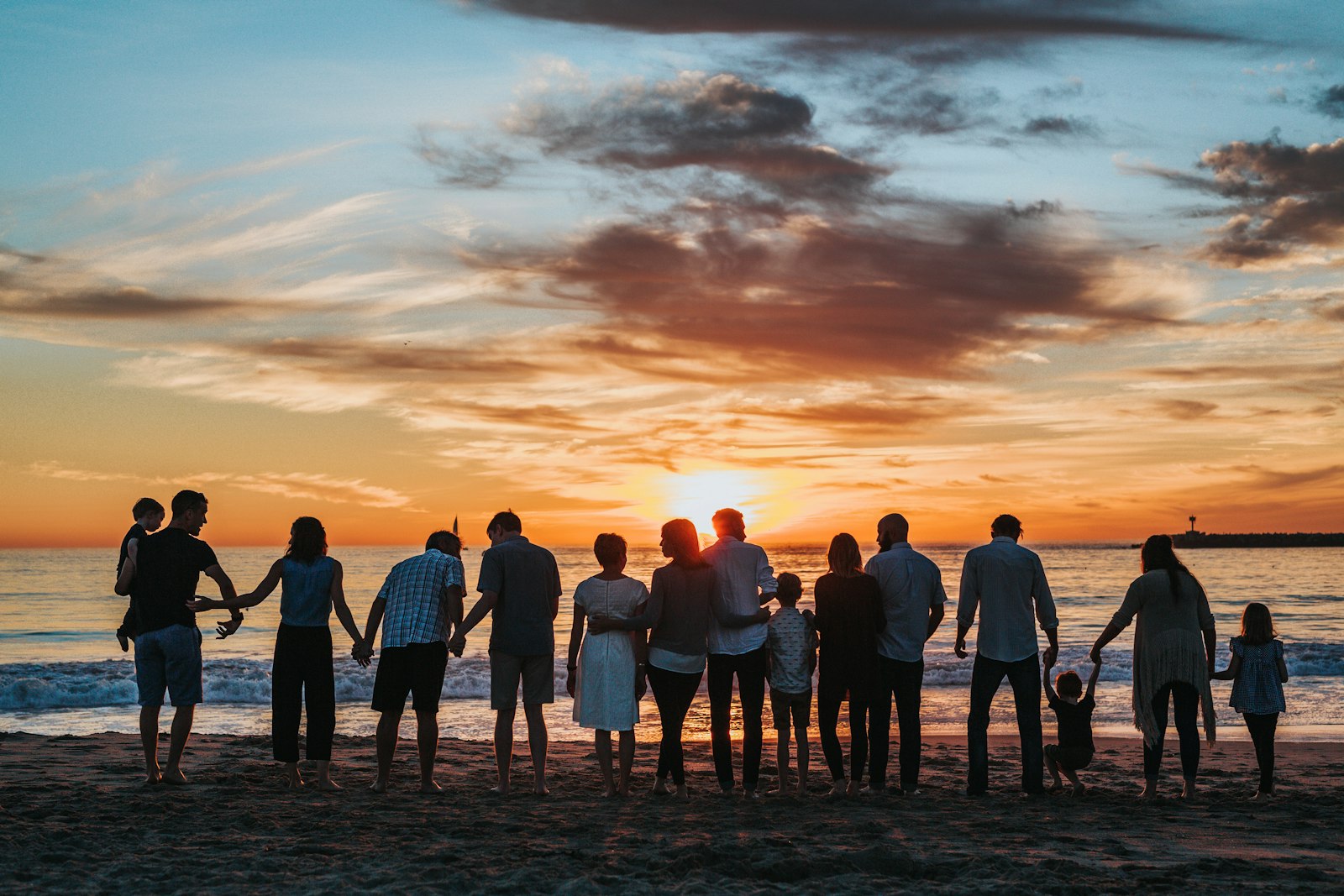 A family together at the shore during a season of change